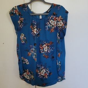 Blue floral blouse.
